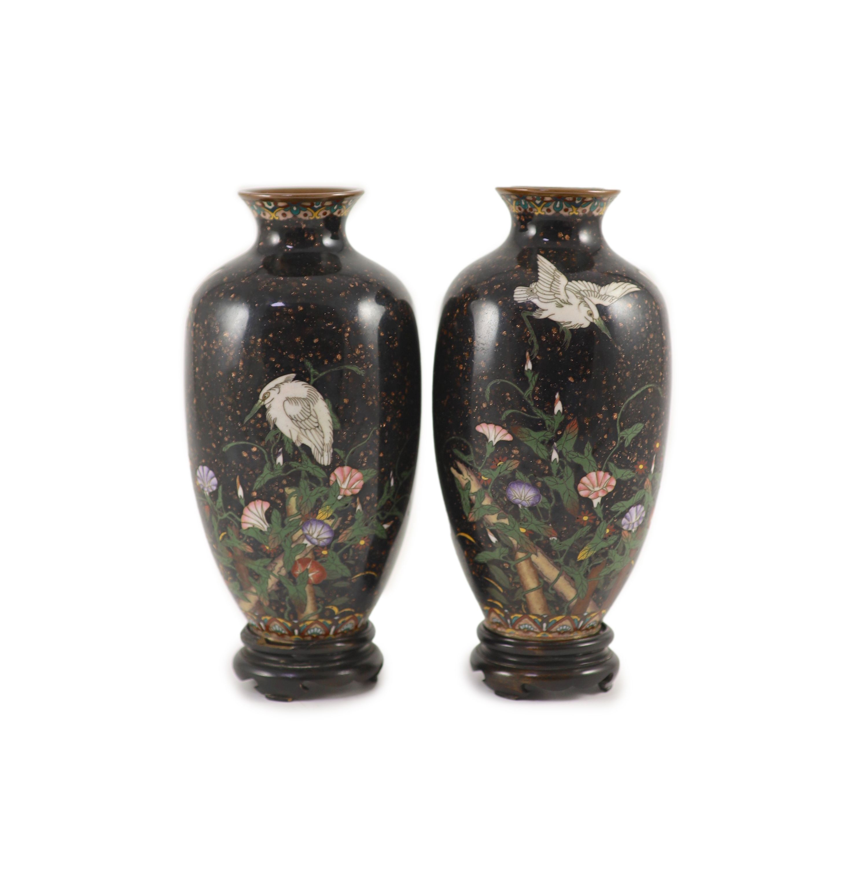 A pair of Japanese silver wire cloisonné enamel ‘egret’ vases, Meiji period, 18.5 cm high, wood stands